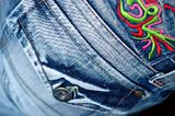 Close up photo of jeans back pocket