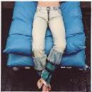 Person laying on sleeping bag in jeans