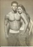 black and white photo of male and female model in jeans