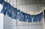 Little jeans hanging on a line with clothes pins