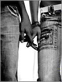 Holding hands in jeans