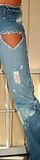 Jeans leg with rips and holes