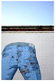 Photo of jeans painted on a brick wall