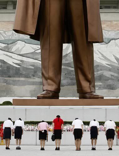 north korean women marching. North Korean women pay their
